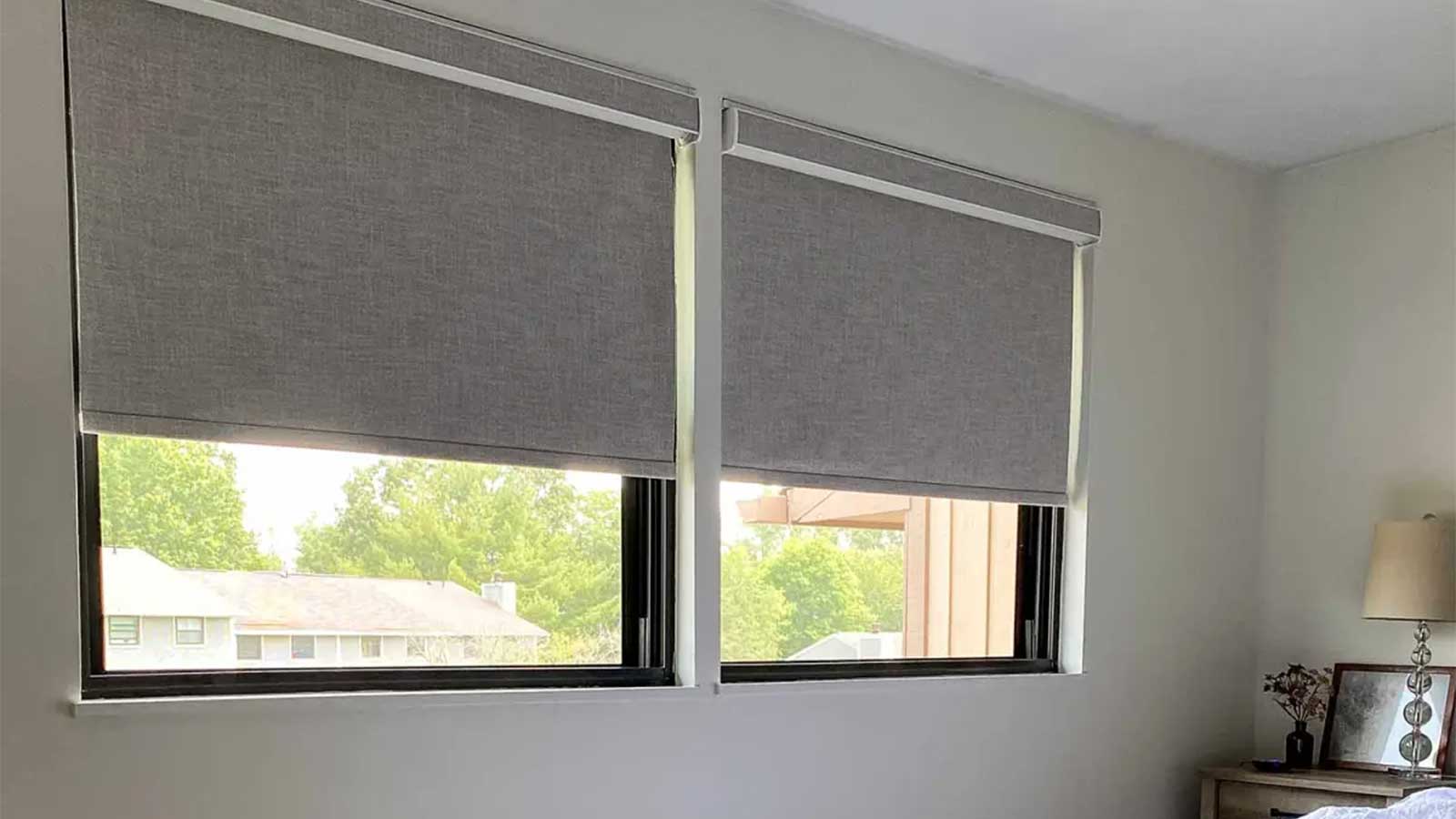 Blackout roller blinds from SelectBlinds in a bedroom