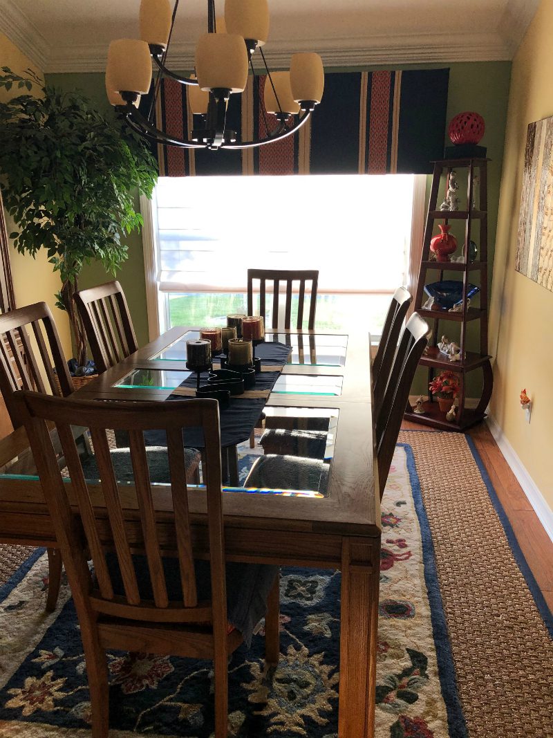 Dining Room with Area Rug with White Roman Shades from Select Blinds