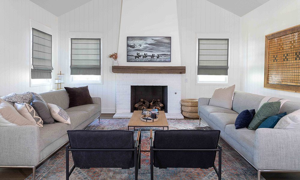 Traditional living room showcasing grey roman shades