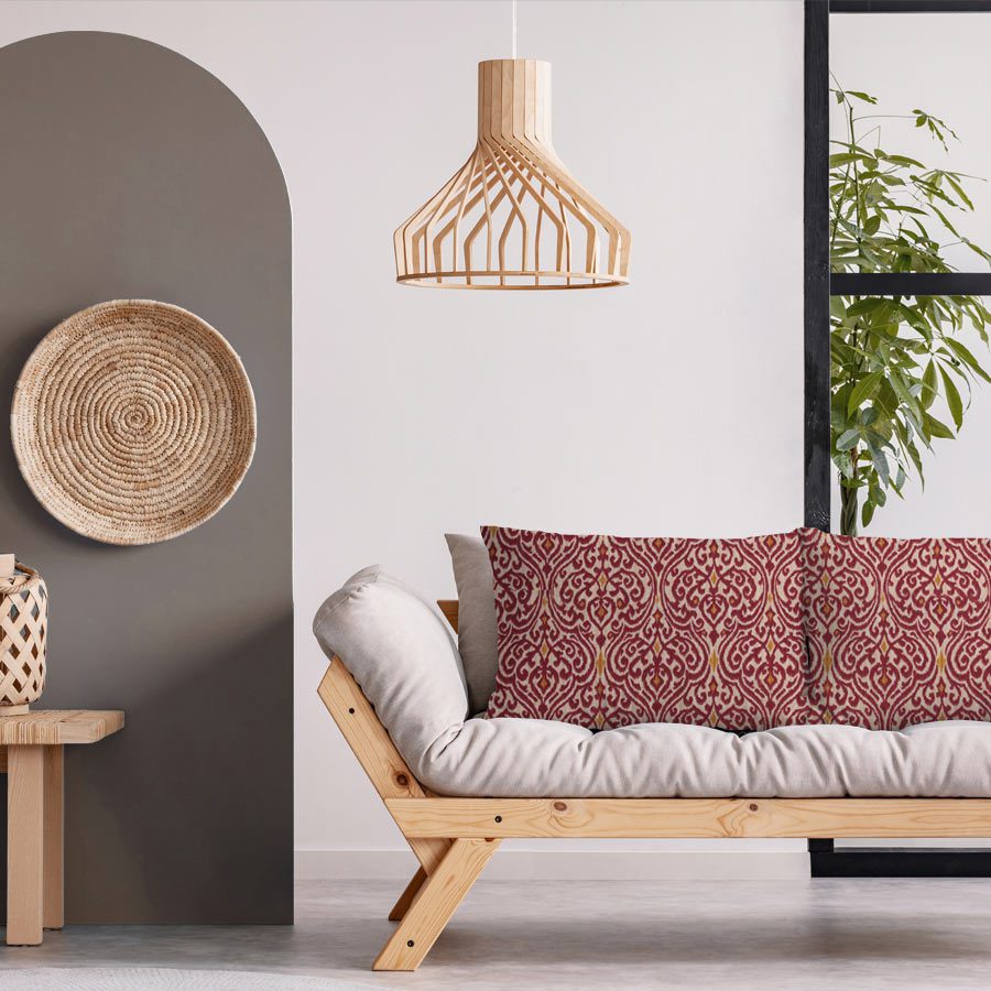 Scandinavian living room with a couch featuring pillow covers made from Bohemian Red fabric