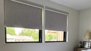 Blackout roller blinds from SelectBlinds in a bedroom