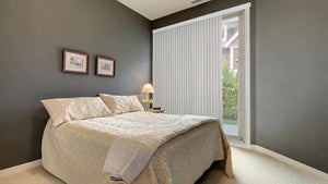 Bedroom with vertical blinds