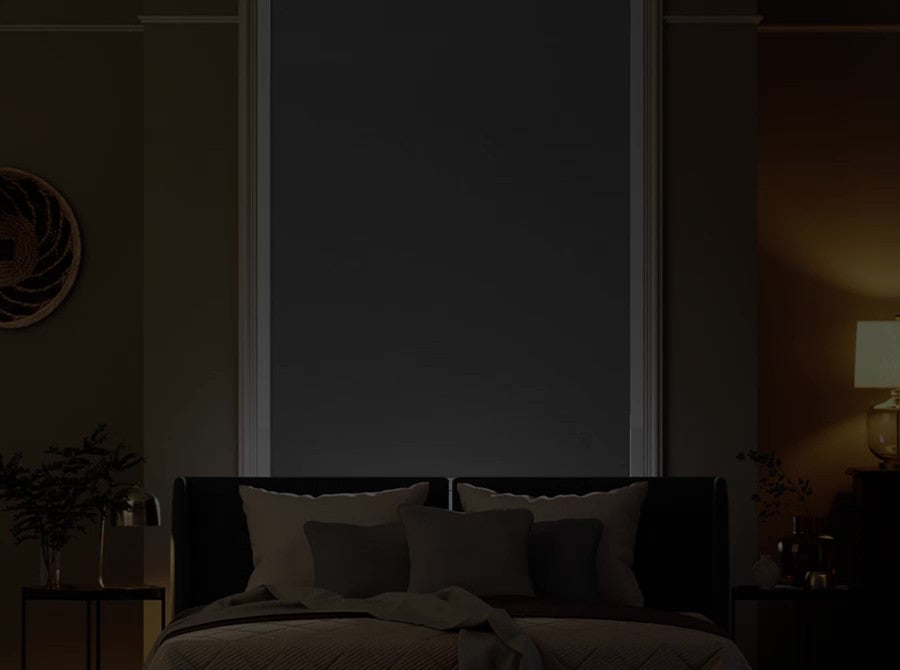 Total blackout roller shade in a bedroom.
