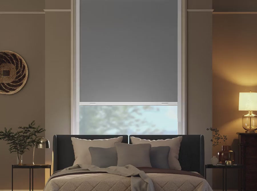 Total blackout roller shade in a bedroom.